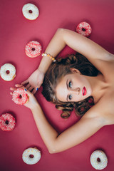 Obraz na płótnie Canvas Girl with a donut
