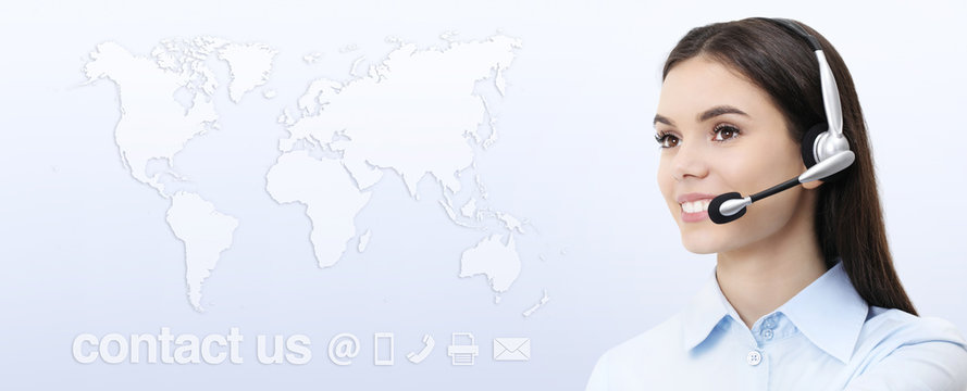 Customer service operator woman with headset smiling, world map on background, contact us concept