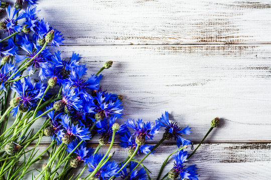 Blue Flowers, Summer Wildflowers On Wooden Background, Overhead