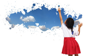 Obraz na płótnie Canvas Schoolgirl paint sky on the wall