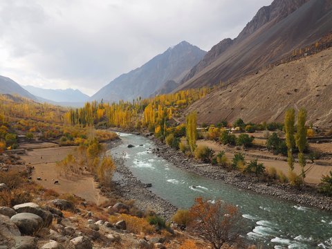 Golden Autumn Mountains And Lake Along Hindu Kush Mountain Range In Ghizer Valley, Northern Pakistan