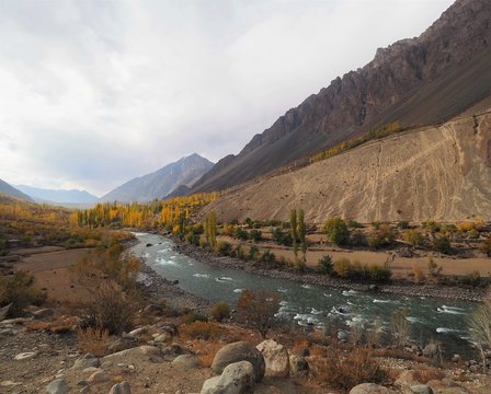 Golden Autumn Mountains And Lake Along Hindu Kush Mountain Range In Ghizer Valley, Northern Pakistan