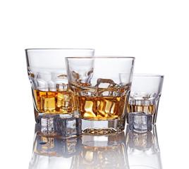 Three glasses of scotch whiskey with ice cube