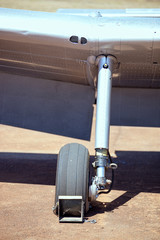 Chocked wheel on old plane