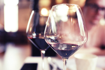 Serving a glass of red wine in a restaurant