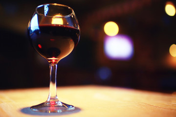 Serving a glass of red wine in a restaurant