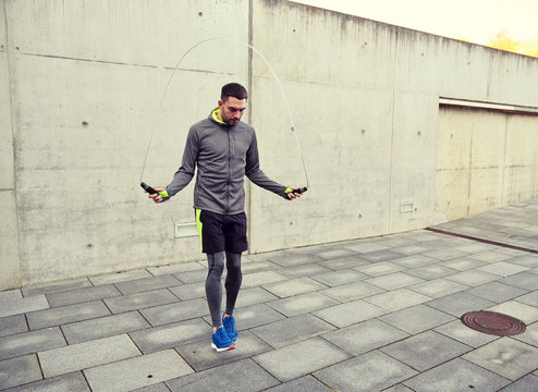 man exercising with jump-rope outdoors