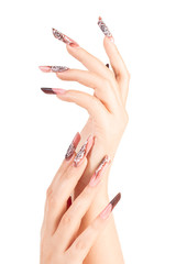 Two crossed hands with beautiful fingernails over white background