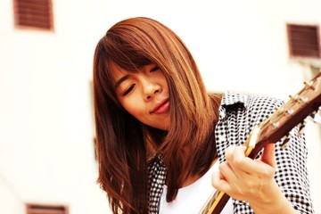 Woman is playing guitar