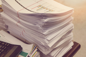 Business Concept, Pile of unfinished documents on office desk, Stack of business paper, Vintage Effect