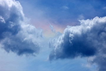 Blue sky with white clouds and rainbow.