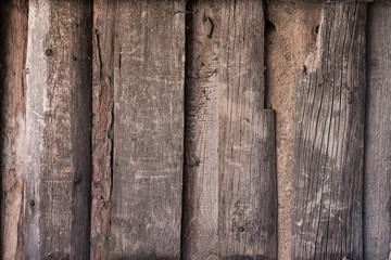 Old wooden background texture of the panel. Planks with nails and cobwebs. A fence of old boards.