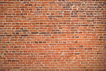 Abstract background texture of wall from a red brick. Texture of old brickwork.
