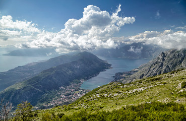 Fototapeta premium Top view of Kotor, Montenegro, Europe. Boka Kotor bay Boka Kotorska is one of the most beautiful places on Adriatic Sea, it boasts the preserved Venetian fortress, old towns and scenic mountains.