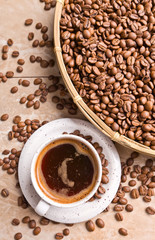 Cup of black coffee and  beans