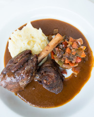 Roast lamb shank with Vegetables and potato paste