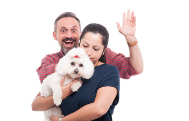 Cute bichon dog and his owners