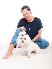 Smiling woman with her fluffy dog