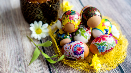 Decorated Easter eggs on a wooden background. The concept of Easter.