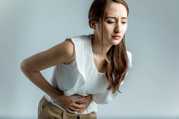 young woman having a stomachache