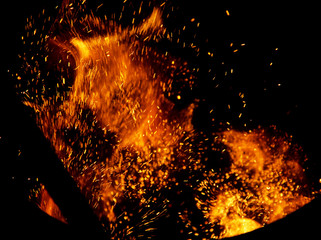 Flame of fire with sparks on a black background