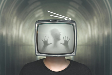 Fototapeta premium desperate man trapped in a television surreal concept