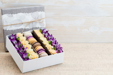 Box with flowers and macaroons