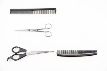 Hair cutting shears and comb isolated on white