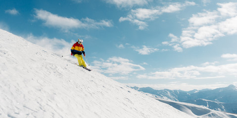 girl with special ski equipment is riding very fast in the mountain hill
