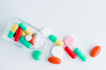 Medicine pills macro poured from a jar