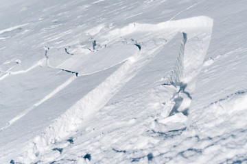 snow field with trail track