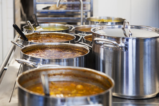 Various food items in containers on kitchen counter