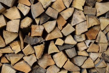 Firewood for fire expansionfirewood. Chopped wood. Wooden background