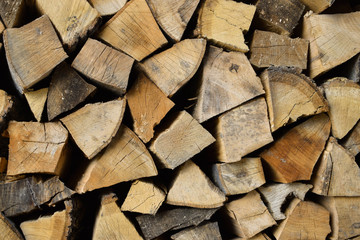 Firewood for fire expansionfirewood. Chopped wood. Wooden background