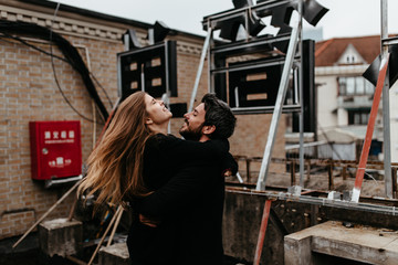 Couple hugging each other on the rooftop
