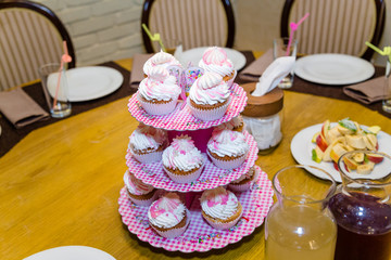 nice girlish pink and white cupcakes on the plate