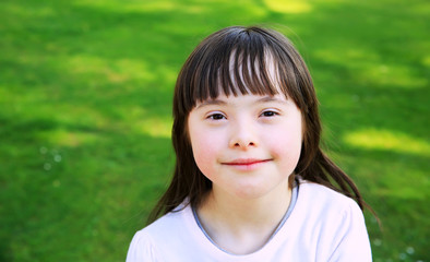 Portrait of little girl smiling outside