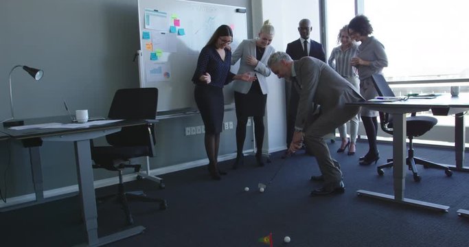 Group of business people teambuilding at office playing games laughing and having fun