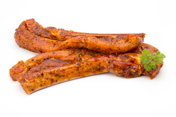 Spicy marinated spare ribs barbecued on the white background.