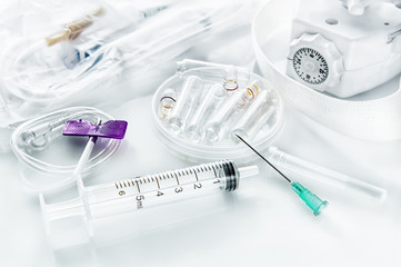 Dropper syringe with needle and catheter for intravenous injection with harness and ampoules for medication