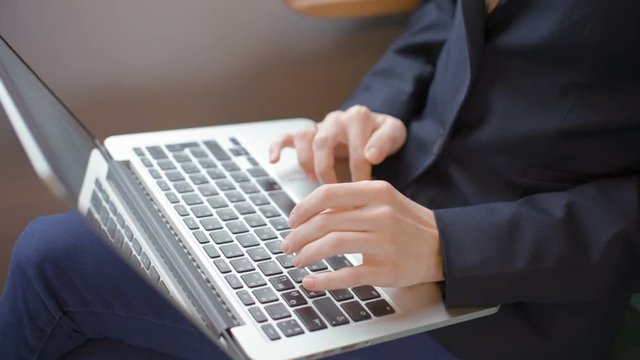 Neat Hands of a Young Beautiful Business Lady are Typing Text on a Laptop during the Journey by Train