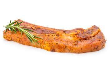 Spicy marinated spare ribs barbecued on the white background.