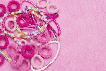 Girlish teenager group of hair ribbons, bracelets, necklaces, hair clips. Vintage style background. Horizontal template for a party design greeting card, with copyspace