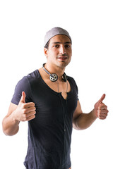 Naklejka premium Good looking guy with headphones, smiling, thumbs up