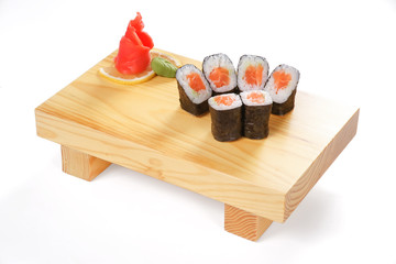 Traditional Japanese cuisine, sets of sushi and rolls on a wooden stand