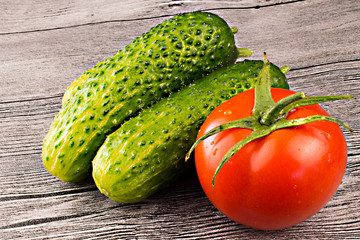 Tomatoes and cucumber on the table