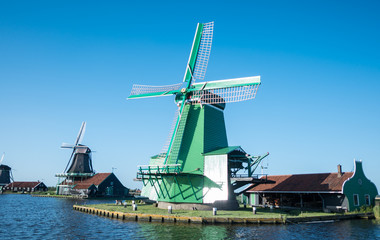 Traditional Dutch windmills with canal close - Zaanse schans, Holland
