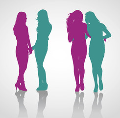 Detailed vector silhouettes of teenage girls holding hands. Silhouettes of teenage girls walking embracing one another