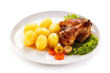 Roast chicken leg with potatoes