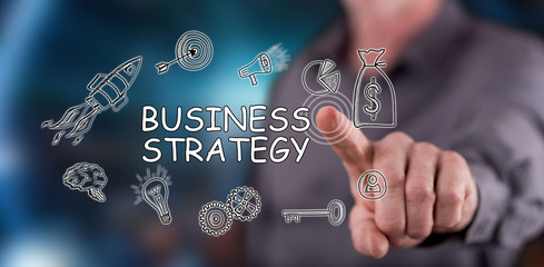 Man touching a business strategy concept on a touch screen